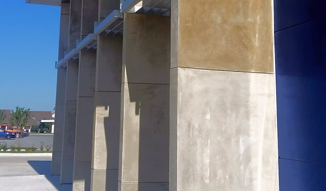 Polished tan columns on a commercial building.