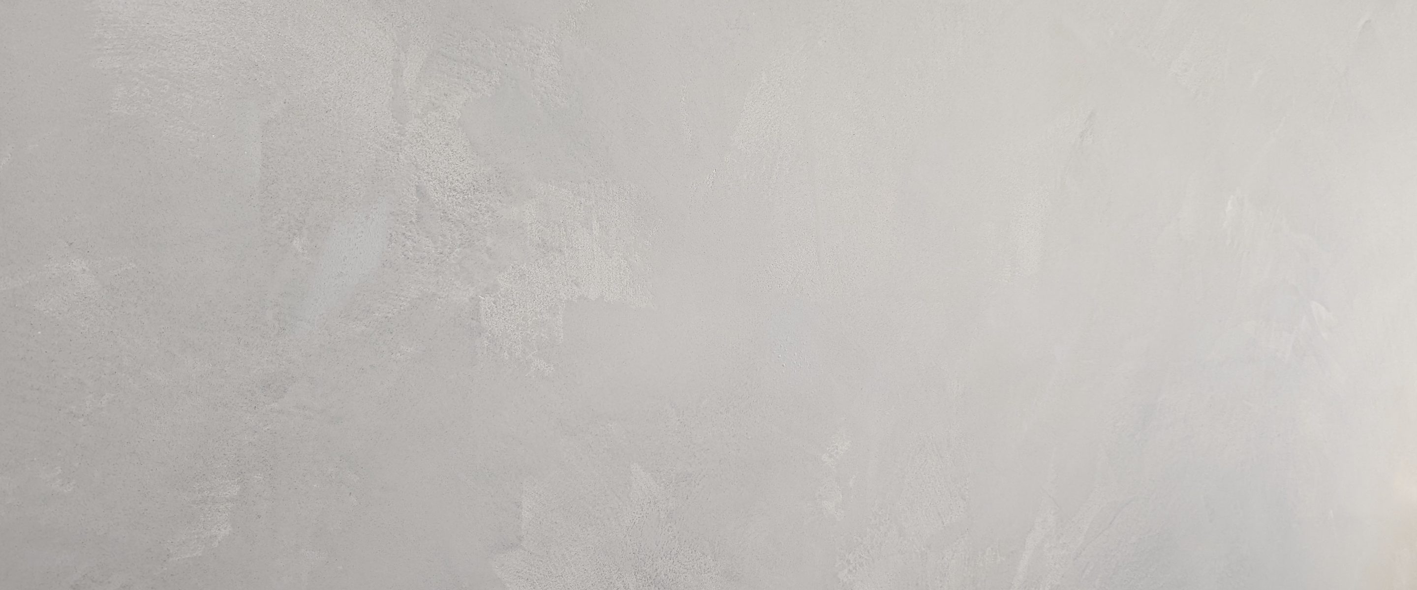 A Venetian-smooth white surface.