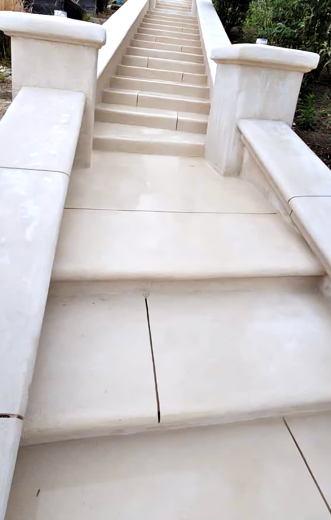 A white limestone-coated stair and terrace.